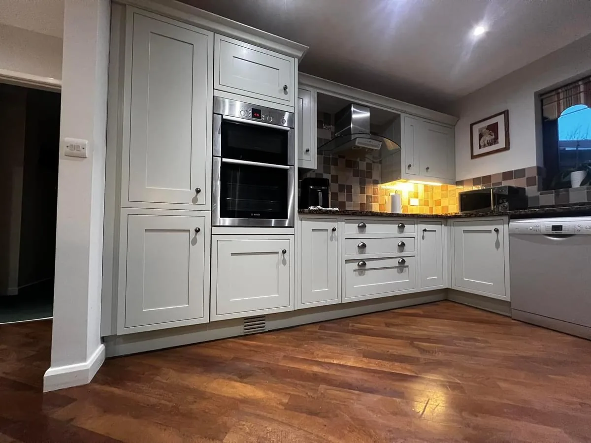 Pale grey shaker kitchen resprayed throughout